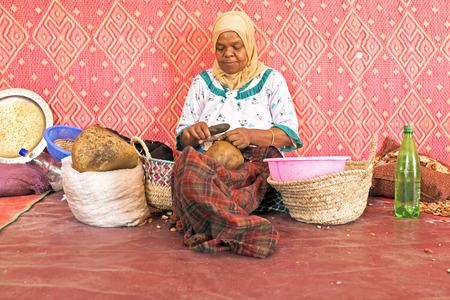MOROCCO, AURIKA VALLEY - OCTOBER 24: Woman at work in a cooperative for manufacturing argan oil on 24th october in Moroccoのeditorial素材