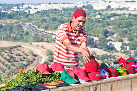 FES, MOROCCO - OCTOBER 17, Moroccan trader with his handmade merchandise in Fes Moroccoのeditorial素材