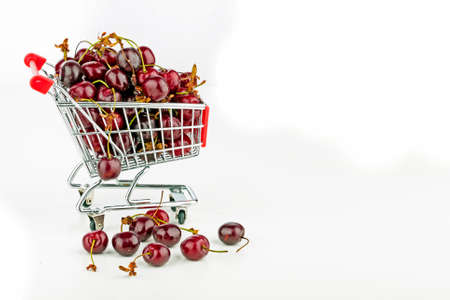 Fresh cherries in a supermarket cartの写真素材