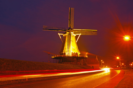 Traditional windmill in the countryside at night in the Netherlandsの写真素材