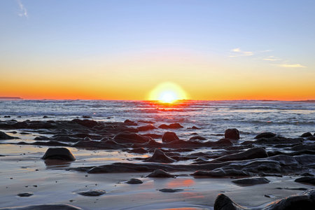 Sunset at Praia Vale Figueiras in Portugalの写真素材