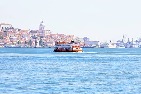 Ferry cruising on the river Tejo near Lisbon Portugalの写真素材