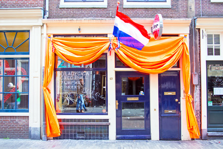 AMSTERDAM - APR 27: Decorated dutch cafe in Amsterdam at Kings Day on April 27. 2015 in the Netherlandsのeditorial素材