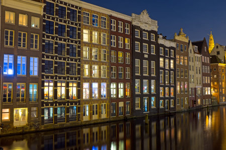 Amsterdam medieval houses by night in the Netherlandsの写真素材