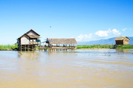 Traditional floating village houses in Inle Lake, Myanmarの写真素材