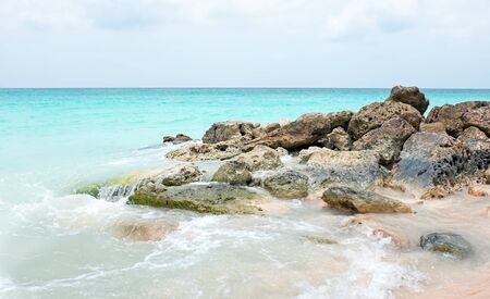 Rocks in the caribbean sea on Aruba islandの写真素材