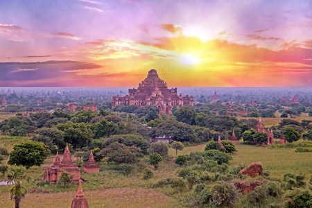 Ancient pagodas in the landscape from Bagan in Myanmar at sunriseIn the middle the Dhammayangyi Temple, The biggest of all temple in Bagan. Over 10,000 Buddhist temples, pagodas and monasteries were constructed in Bagan.の写真素材