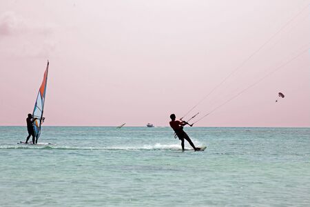 Watersport on theCaribbean Sea at Aruba island at sunsetの写真素材