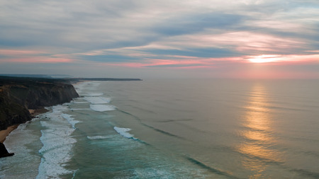 Aerial from a beautiful sunset at Vale Figueiras beach in Portugalの写真素材