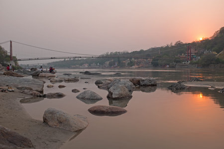 At the river Ganges near Laxman Jhula in India at sunset