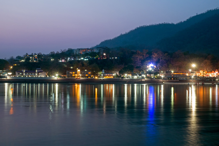 At the river Ganges at Laxman Jhula in India at nightの写真素材