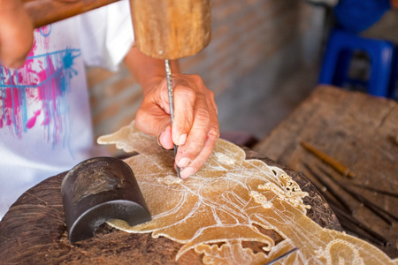 Making tradititional wajang puppet on Java Indonesiaの写真素材