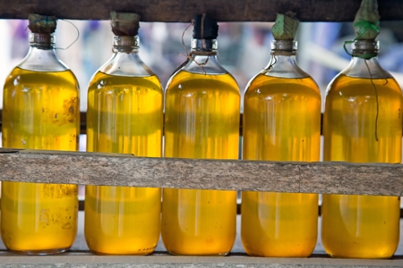 Gasolina in bottles for sale on Java Indonesiaの写真素材