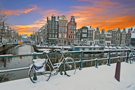 Cityscenic from Amsterdam in winter in the Netherlands at sunsetの写真素材