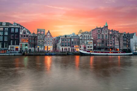 Amsterdam at the river Amstel at sunset in the Netherlandsのeditorial素材