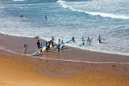 VALE FIGUEIRAS, PORTUGAL - JULY 19, 2018: Aerial from surfers getting surfers lessons at Praia Vale Figueieras in Portugalのeditorial素材