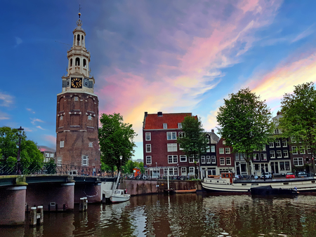 Traditional medieval watertower - Montelbaan tower - in Amsterdam Netherlands at sunsetのeditorial素材