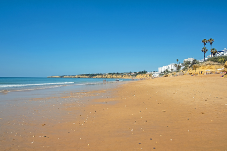 The beach in Armacao de Pera in the Algarve Portugalの写真素材