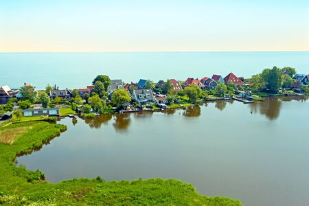 Aerial from the traditional village Uitdam at the IJsselmeer in the Netherlandsの写真素材