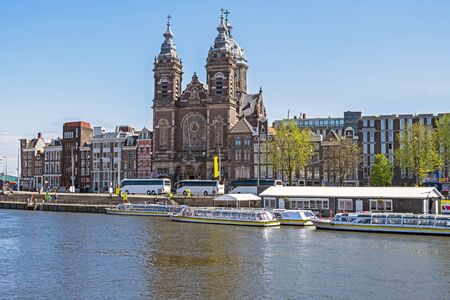 City scenic from Amsterdam with the Niklaas church in the Netherlandsの写真素材