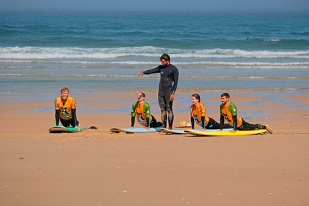 Vale Figueiras, Portugal - April 8, 2019: Surfers getting surfers lessons at praia Vale Figueiras in Portugalのeditorial素材