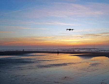 Drone flying at the beach at a beautiful sunset in Portugal