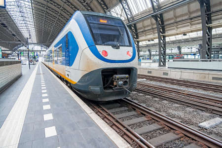 Train ready for departure on an empty central station in Amsterdam Netherlands during the corona crisisのeditorial素材