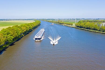 Aerial from shipping on the Amsterdam Rijnkanaal in the countryside from the Netherlandsの写真素材
