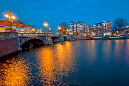 The Blauwbrug at the Amstel in Amsterdam the Netherlands at sunsetの写真素材
