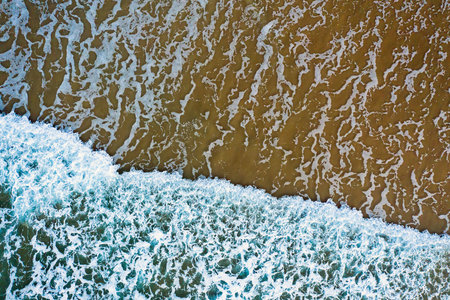 Aerial topshot from ocean waves at the atlantic ocean