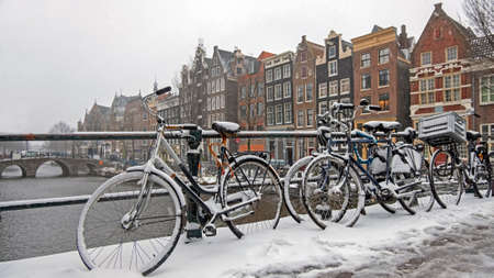 City scenic from a snowy Amsterdam in winter in the Netherlandsの写真素材