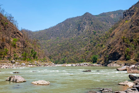 The holy river Ganga in the Himalaya mountains in India Asiaの写真素材