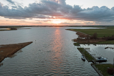 Aerial from a sunset in the countryside from Friesland at the Galamadammen in the Netherlandsの写真素材