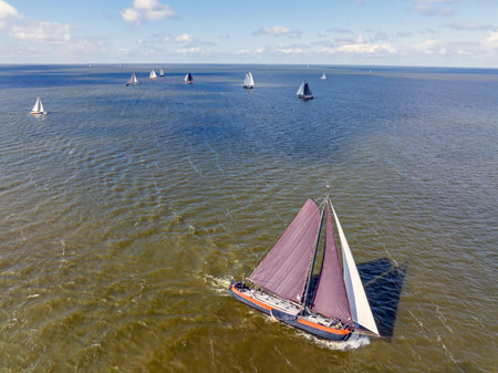 Aerial from sailing competition at Stavoren in the Netherlands with traditional historical sailing boatsの写真素材