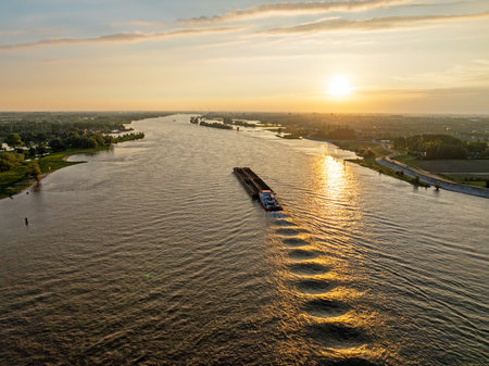 Aerial from shipping on the river Merwede near Gorinchem in the Netherlands at sunset