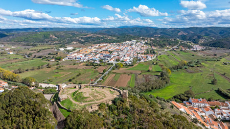 Aerial from the castle and village Aljezur at the west coast in the Algarve Portugalの写真素材