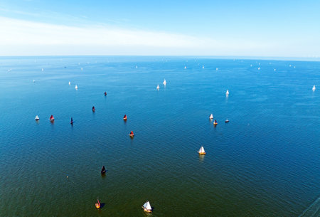 Aerial from sailing with old and new ships on the IJsselmeer in the Netherlandsの写真素材
