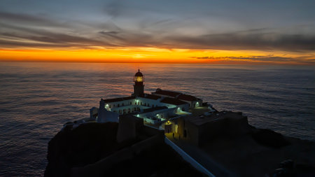Aerial from the lighthouse Cabo Vicente at Sagres in Portugal at sunsetの写真素材