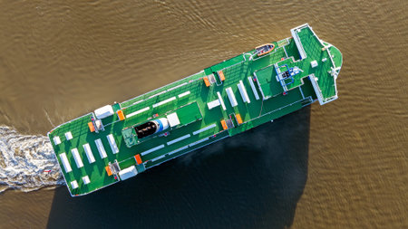 Top down view of a ferry cruising on water