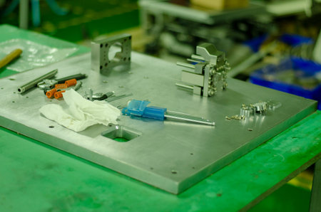 Set of tools on a table panel with spare part the machine.