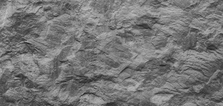 Abstract dark grey black slate background or texture. Close-up. Light gray rock backdrop.