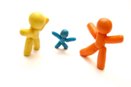 3 plasticine figures staying together and celebratingの写真素材