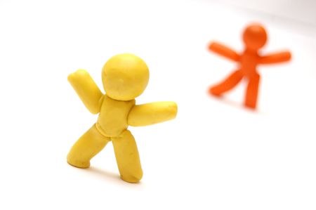 2 plasticine figures staying in front of each other. Competition conceptの写真素材