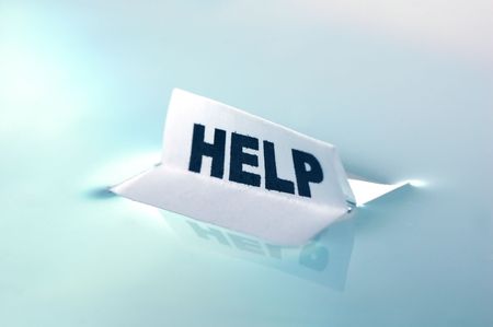 Card floating on water surface with printed word: HELPの写真素材