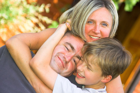 Mother, father and son having fun outdoor 