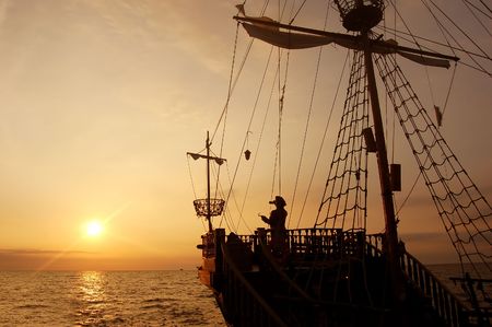 Pirate ship in sunset sceneryの写真素材