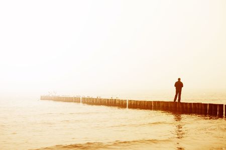 Man contemplates sunrise, conceptual imageの写真素材