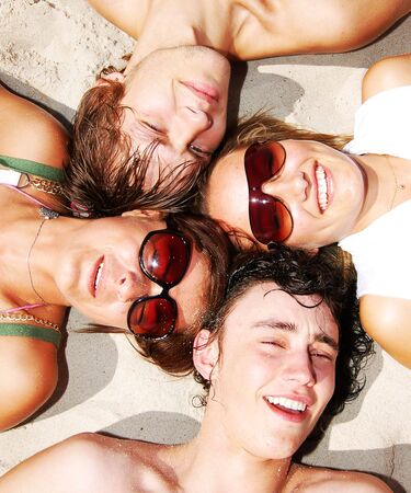 Young attractive friends enjoying the summertime and company of each other. の写真素材