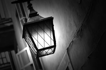 Retro street lamp shining at nightの写真素材