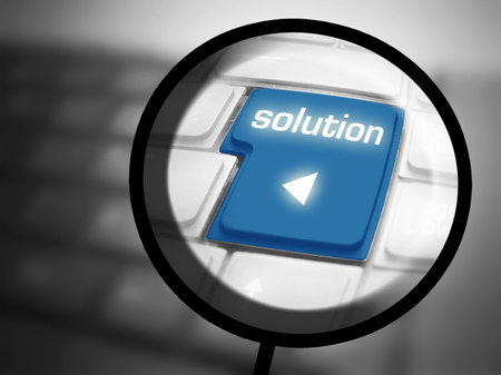 Solution button with magnyfying glass and keyboard. Isoalted on white